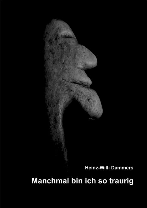 Text: "Heinz-Willi Dammers. Manchmal bin ich so traurig." Profilansicht eines skulpturartigen Gesichts mit markanten Merkmalen.