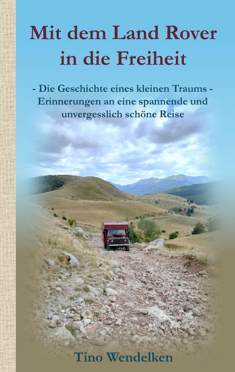 Buchtitel „Mit dem Land Rover in die Freiheit“, Text über Träume und Reisen, unten der Name Tino Wendelken. Landschaft mit Fahrzeug.