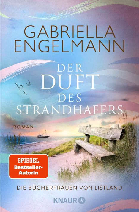 „Gabriella Engelmann, Der Duft des Strandhafers, Roman, SPIEGEL Bestseller-Autorin, Die Büchfrauen von Listland, Knaur.“<br>Strand mit Bank im Hintergrund.