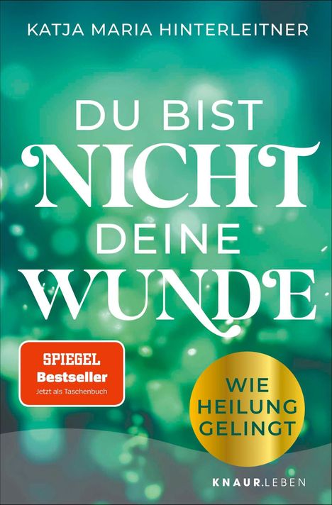 Text: "DU BIST NICHT DEINE WUNDE", "SPIEGEL Bestseller", "Wie Heilung gelingt". Grüner Hintergrund mit Lichtreflexen.