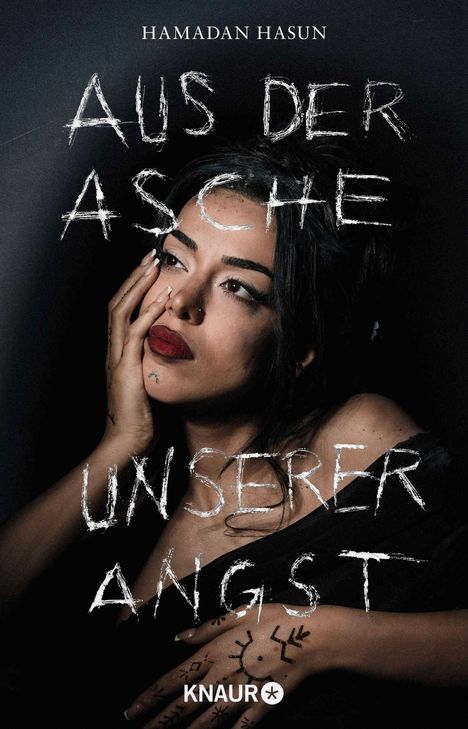 Text: "HAMADAN HASUN", "AUS DER ASCHE UNSERER ANGST", "KNAUR". Eine Frau berührt nachdenklich ihr Gesicht; dunkler Hintergrund.