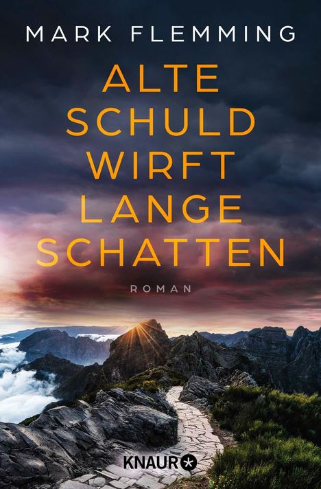Titel: "Alte Schuld wirft lange Schatten" von Mark Flemming, darunter "Roman". Eine Berglandschaft bei Sonnenaufgang.
