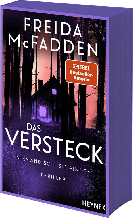 Text: "Freida McFadden, Das Versteck, Niemand soll sie finden, Thriller, SPIEGEL Bestseller-Autorin, Heyne." Hintergrund: Hütte im Wald.