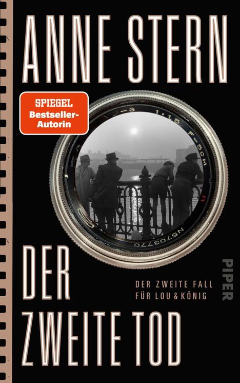 Text: "Anne Stern", "Der zweite Tod", "Der zweite Fall für Lou & König", "SPIEGEL Bestseller-Autorin". Eine Kameraobjektiv-Illustration.