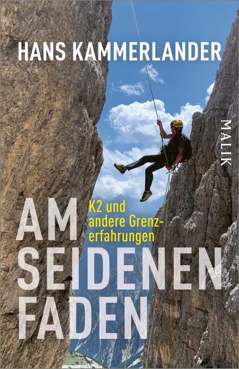 "HANS KAMMERLANDER, AM SEIDENEN FADEN, K2 und andere Grenzerfahrungen. Ein Kletterer seilt sich zwischen Felswänden ab."