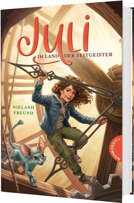 „Juli im Land der Zeitgeister“ ist in roter Schrift zu sehen. Ein Mädchen klettert auf Zahnrädern, begleitet von einer Kreatur.