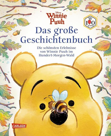 Winnie Puuh: Das große Geschichtenbuch. Illustration von Puuh mit einer Biene auf der Nase, umgeben von bunten Blättern.