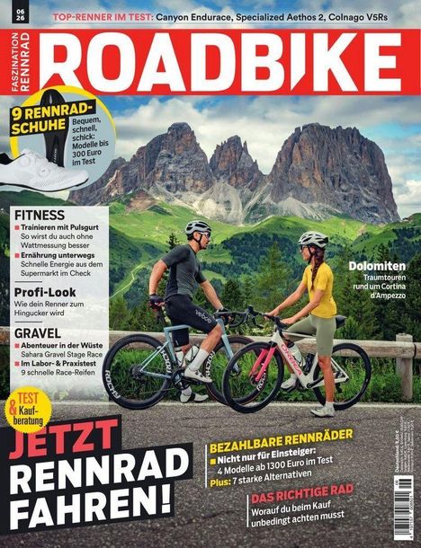 Oben: "ROADBIKE". 
Unten: "JETZT RENNRAD FAHREN!" 
Vorn: Zwei Radfahrer vor Bergkulisse.