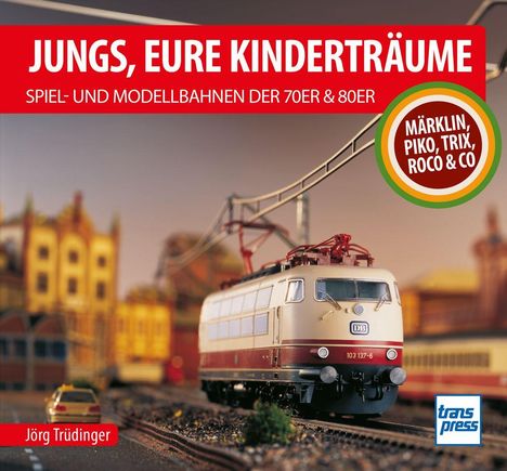 Titel: "Jungs, eure Kinderträume". Modellbahn-Lokomotive vor unscharfem Hintergrund, Logo unten rechts.