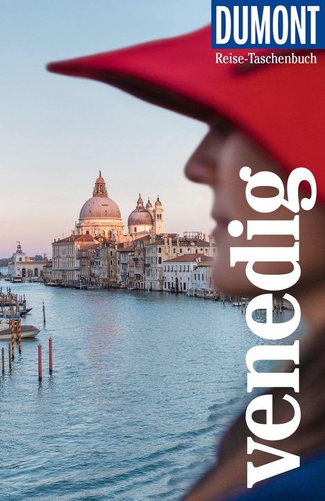 "Venedig" ist vertikal in Weiß am Rand. "DUMONT Reise-Taschenbuch" oben. Blick auf venezianische Gebäude bei Sonnenuntergang.