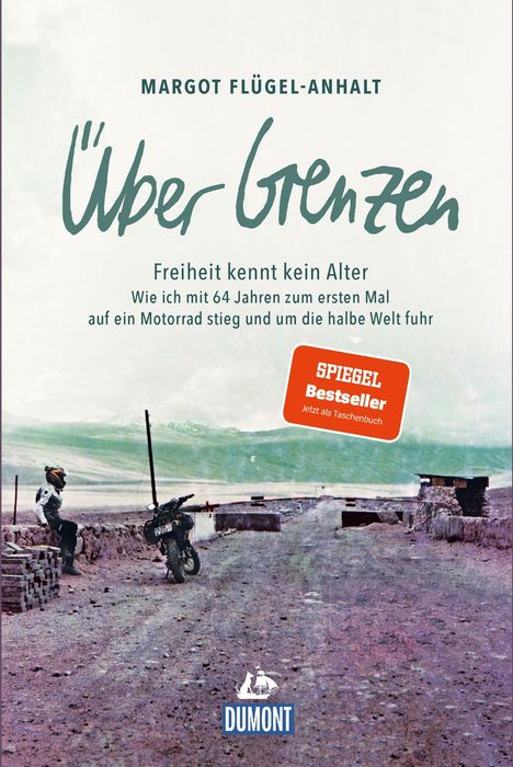 Text: "Über Grenzen", "Freiheit kennt kein Alter", "SPIEGEL Bestseller". Szene: Person mit Motorrad vor Gebirgslandschaft.