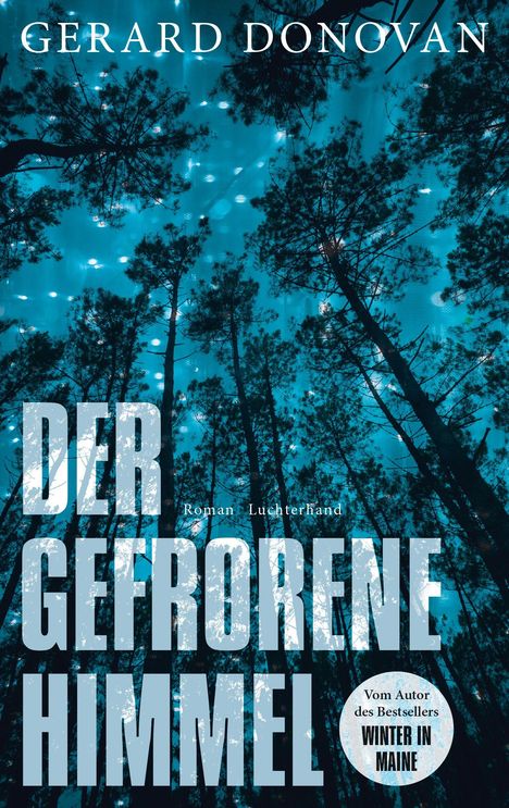„GERARD DONOVAN“, „DER GEFRORENE HIMMEL“, „Roman Luchterhand“; Waldansicht, Bäume bei Nacht mit blauem Himmel.