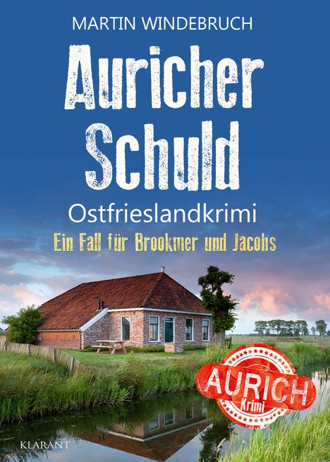 „Martin Windebruuch: Auricher Schuld. Ostfrieslandkrimi. Ein Fall für Brookmer und Jacobs." Landschaft mit Backsteinhaus.