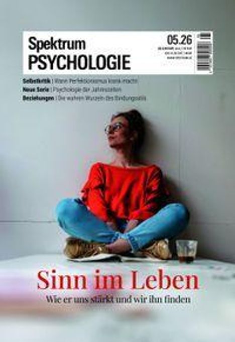 „Sinn im Leben: Wie er uns stärkt und wir ihn finden.“ Eine Frau in rotem Pulli sitzt entspannt an einer Wand.
