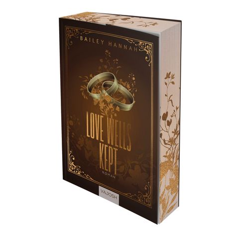 Titel: LOVE WELLS KEPT. Autor: BAILEY HANNAH. Auf dem Cover sind goldene Ringe und florale Muster in Braun- und Goldtönen.