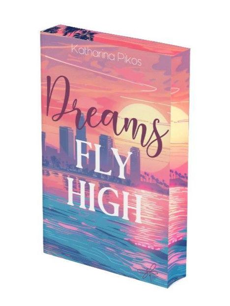 „Dreams Fly High“ auf einem farbenfrohen Buchcover mit Sonnenuntergang und Skyline. Autor: Katharina Pikos.