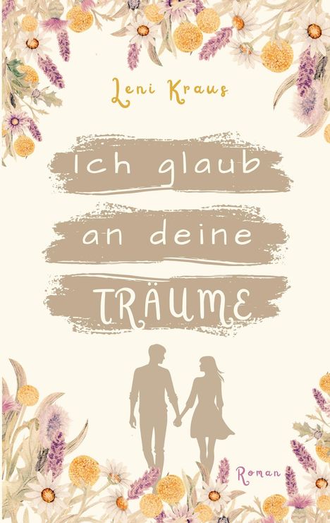 „Ich glaub an deine Träume“ steht in weißen Buchstaben auf beigem Hintergrund. Blumenrahmen, zwei Silhouetten halten Hände.