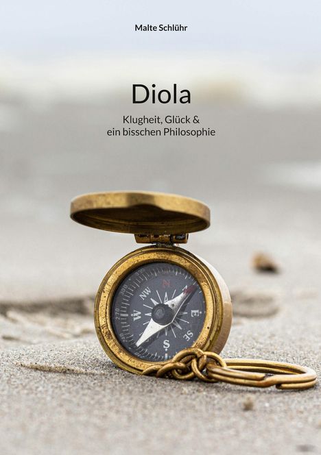 Titel und Untertitel: "Diola: Klugheit, Glück & ein bisschen Philosophie." Im Vordergrund ein offener Kompass im Sand.