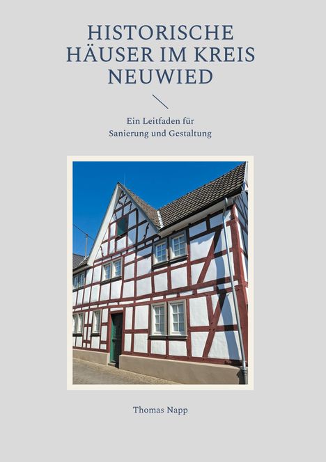„HISTORISCHE HÄUSER IM KREIS NEUWIED“ steht oben. Darunter Fachwerkhaus mit weißer Wand und braunen Balken, blauer Himmel.