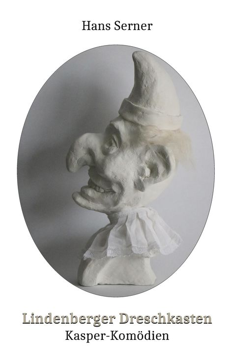 Logo mit dem Text: Hans Serner, Lindenberger Dreschkasten, Kasper-Komödien. Gipsmaske einer Kasperfigur von der Seite.