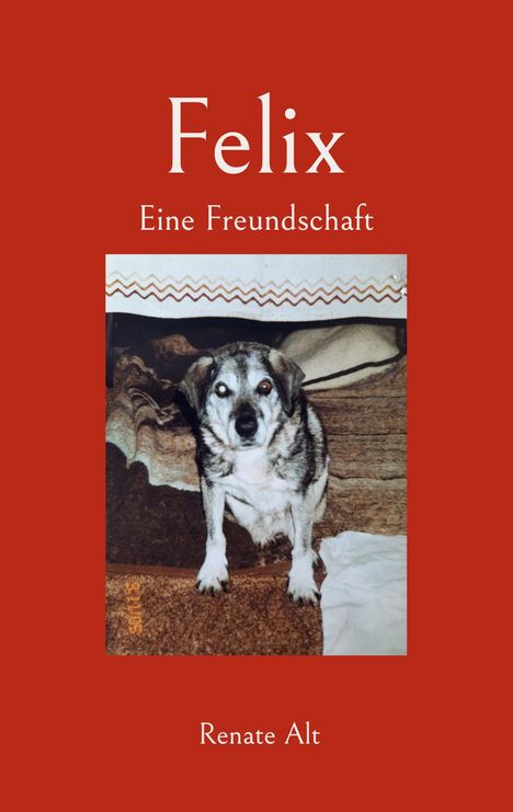 „Felix. Eine Freundschaft“ und „Renate Alt“. Ein Hund sitzt auf einem Teppich mit Decke im Hintergrund.