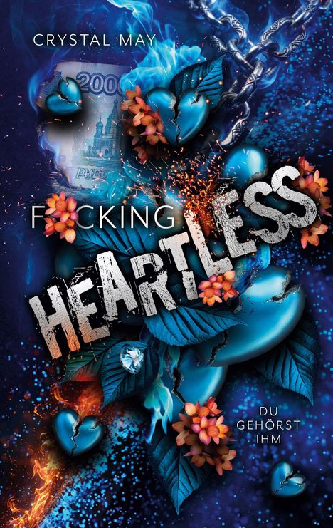 Titel: "F*cking Heartless". Namen: "Crystal May". Text: "Du gehörst ihm". Illustration: zerrissene blaue Herzen, Blumen, Ketten.
