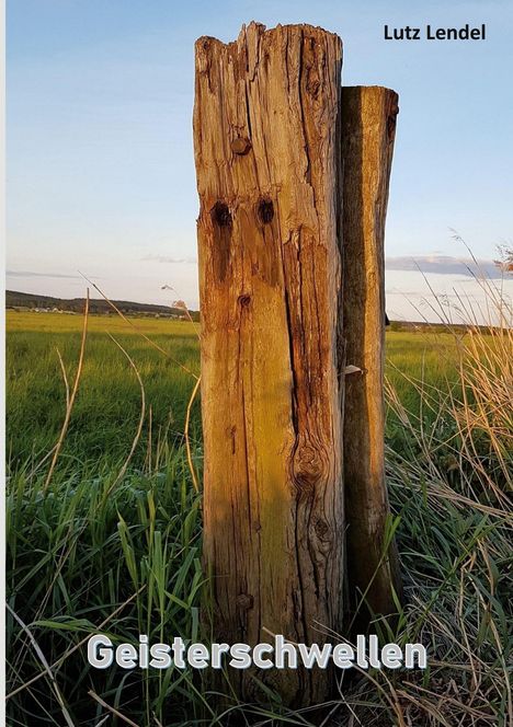 Text oben rechts: "Lutz Lendel". Unten mittig: "Geisterschwellen". Ein verwitterter Holzpfahl steht in einer Wiese in der Landschaft.