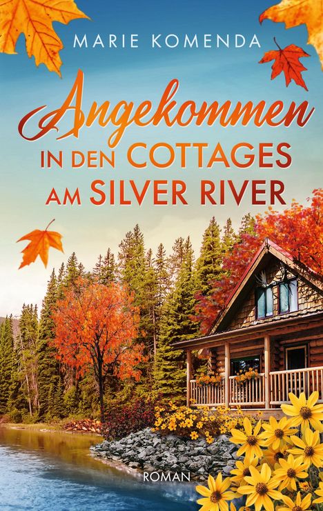 Oben steht "Marie Komenda". Darunter: "Angekommen in den Cottages am Silver River". Darunter: "Roman". Eine herbstliche Hütte am Fluss.