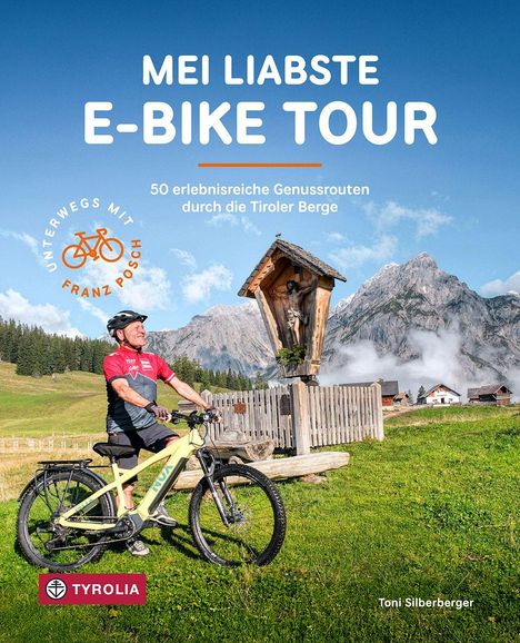 **MEI LIABSTE E-BIKE TOUR**  
50 erlebnisreiche Genussrouten durch die Tiroler Berge.  
Ein Radfahrer mit E-Bike und Helm vor Alpenkulisse.