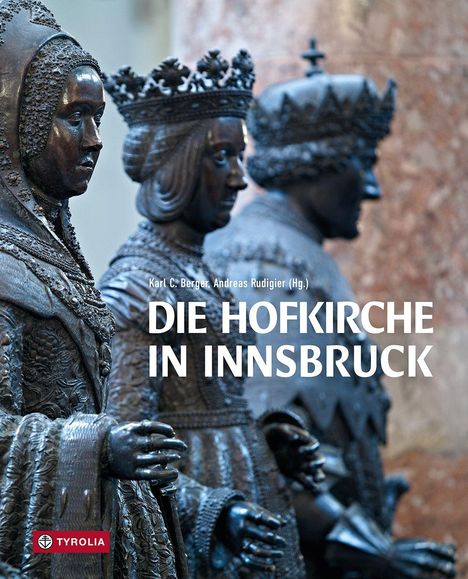 Titel: "DIE HOFKIRCHE IN INNSBRUCK". Statuen in Rüstungen stehen zwischen großen, beigen Marmorsäulen. Tyrolia Logo unten links.
