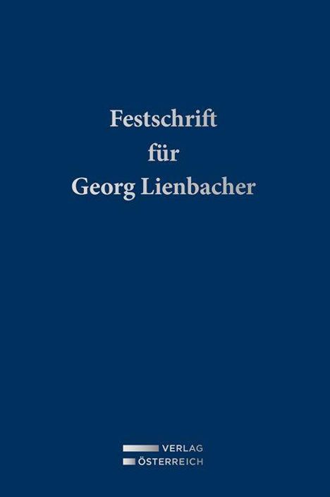 „Festschrift für Georg Lienbacher“ steht auf blauem Hintergrund. Unten ist ein Logo mit „Verlag Österreich“.