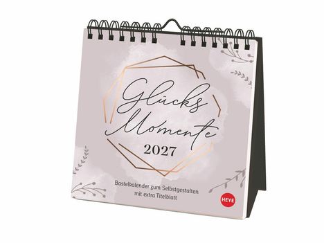 "Glücks Momente 2027. Bastelkalender zum Selbstgestalten mit extra Titelblatt." Design mit floralen Elementen.