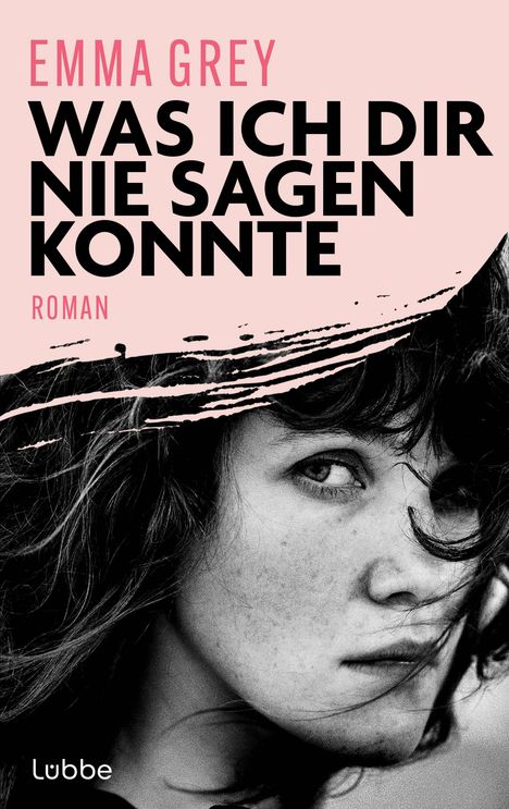 "Emma Grey: Was ich dir nie sagen konnte. Roman." Eine Nahaufnahme einer nachdenklichen Frau mit welligem Haar.