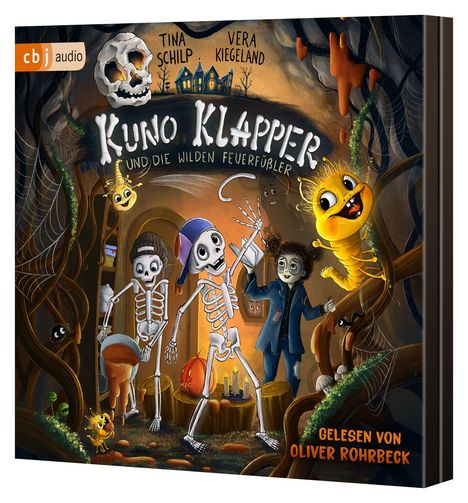 „Kuno Klapper und die wilden Feuerfüßler“, Illustration: Zwei Skelette, ein Junge und ein gelbes Wesen in einer Höhle.