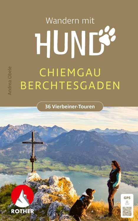 "Wandern mit Hund. Chiemgau Berchtesgaden. 36 Vierbeiner-Touren." Frau und Hund stehen auf Berggipfel, im Hintergrund Alpenpanorama, Kreuz.