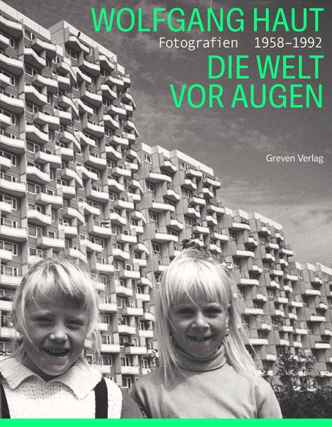 Text: "Wolfgang Haut Fotografie 1958–1992 DIE WELT VOR AUGEN Greven Verlag". Zwei Mädchen vor einem Hochhaus.