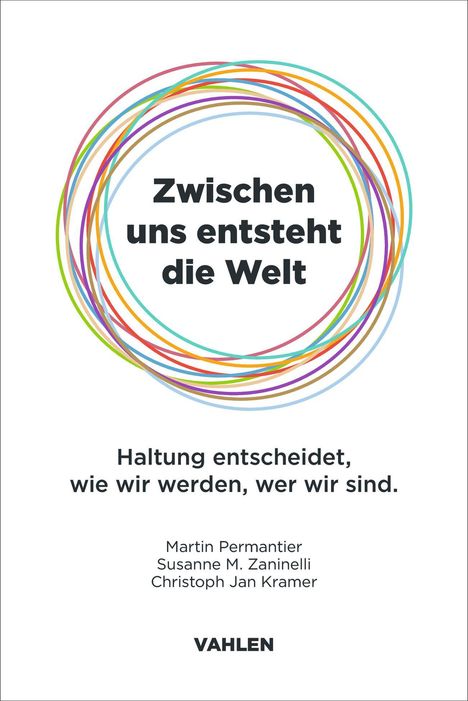 „Zwischen uns entsteht die Welt“. Bunte Kreise um den Text. Darunter Autorennamen und Verlag „Vahlen“.