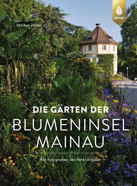 "Die Gärten der Blumeninsel Mainau" in weißem Text. Üppige Gärten mit bunten Blumen und einem runden Turm im Hintergrund.