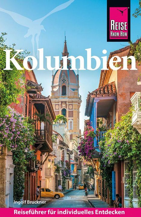 „Kolumbien“, „Ingolf Bruckner“, „Reiseführer für individuelles Entdecken“. Bunte Straße mit Blumen und Turm.