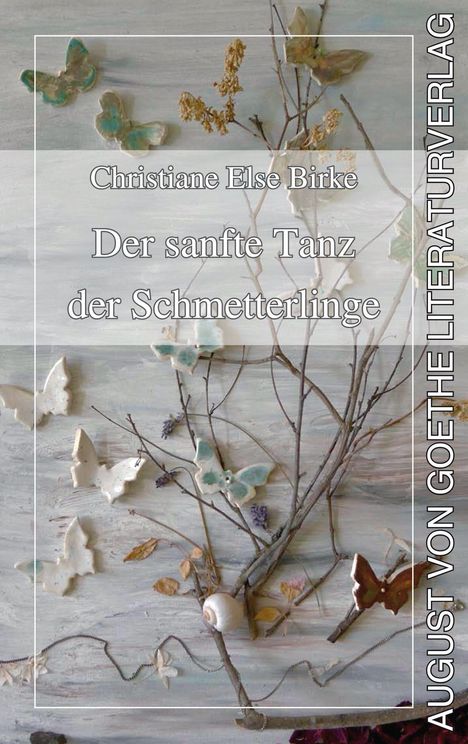 Der Titel lautet "Der sanfte Tanz der Schmetterlinge". Zweige mit Keramikschmetterlingen und Blättern.
