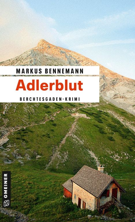 "MARKUS BENNEMANN Adlerblut BERCHTESGADEN-KRIMI" steht über einem Berg und einer Hütte auf grüner Wiese.