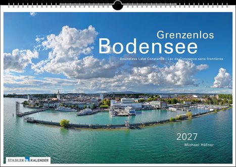 Ein Kalendercover mit dem Text "Grenzenlos Bodensee" und "2027", zeigt eine Hafenpanorama mit Stadt und blauem Himmel.