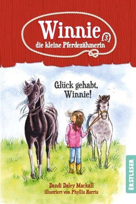 Titel: "Winnie die kleine Pferdezüherin", "Glück gehabt, Winnie!" Ein Mädchen mit zwei Pferden auf einer Wiese.