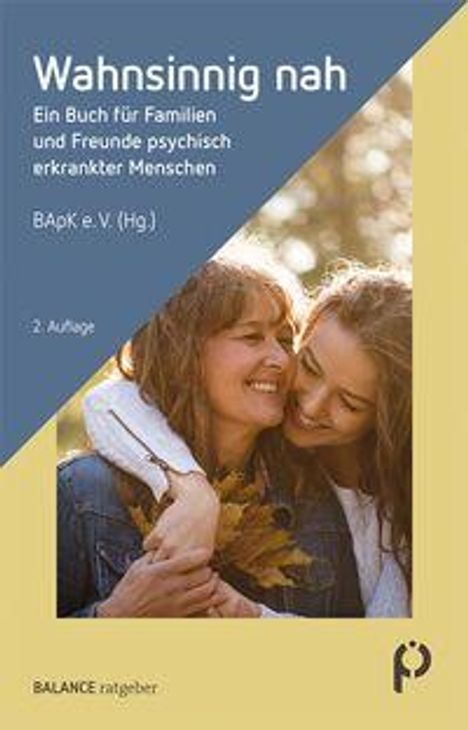 "Wahnsinnig nah. Ein Buch für Familien und Freunde psychisch erkrankter Menschen. 2. Auflage." Zwei Menschen lächeln.