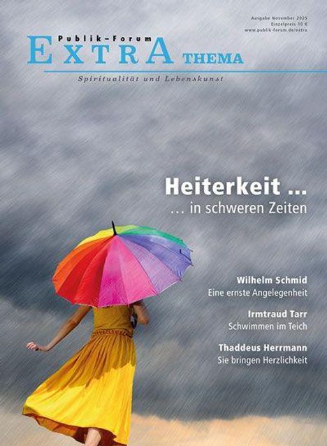 "Publik-Forum Extra Thema: Spiritualität und Lebenskunst. Heiterkeit ... in schweren Zeiten." Person mit buntem Regenschirm.
