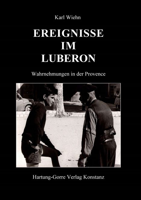 Titel: "Ereignisse im Luberon", darunter "Wahrnehmungen in der Provence". Schwarz-weiß Foto eines Gesprächs zwischen zwei Männern.