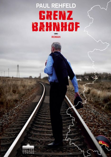 „PAUL REHFELD GRENZ BAHNHOF ROMAN“ in großen Buchstaben. Ein Mann auf einer leeren Eisenbahnstrecke, hält Hut.