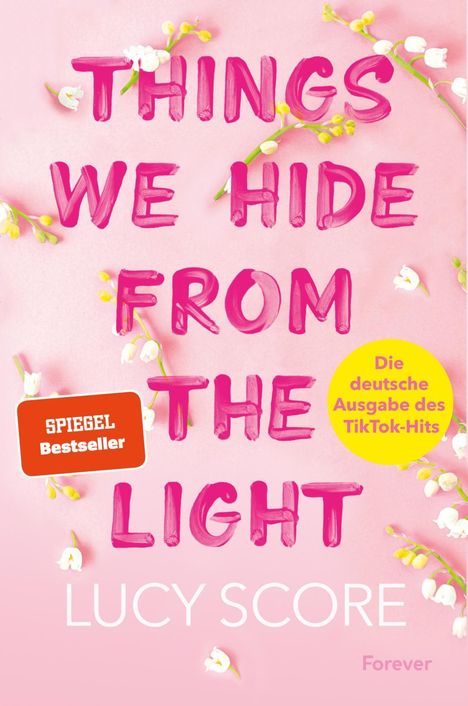 „THINGS WE HIDE FROM THE LIGHT“, rosa Hintergrund mit weißen und gelben Blüten.