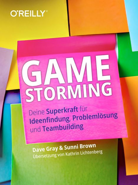 "GAME STORMING" in weiß auf pinkem Hintergrund. Text darunter über Ideenfindung. Bunte Notizzettel im Hintergrund.