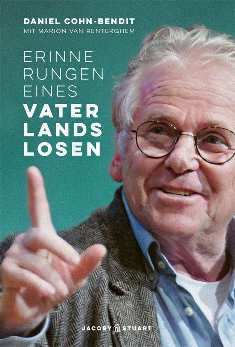 Text: "Erinnerungen eines Vaterlandslosen." Daniel Cohn-Bendit lächelt, trägt eine Brille und zeigt mit dem Finger.